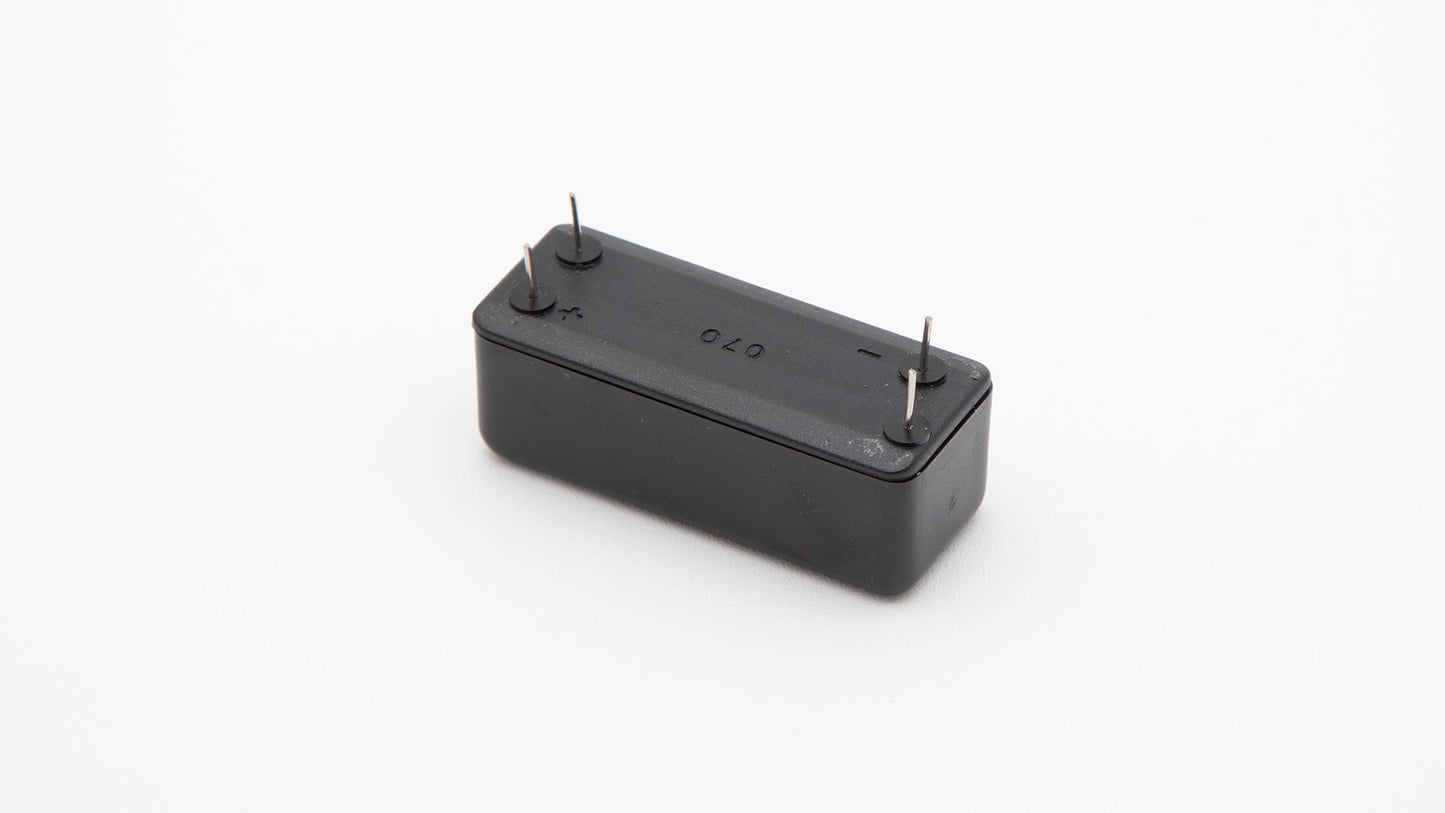 A black battery with connection terminals