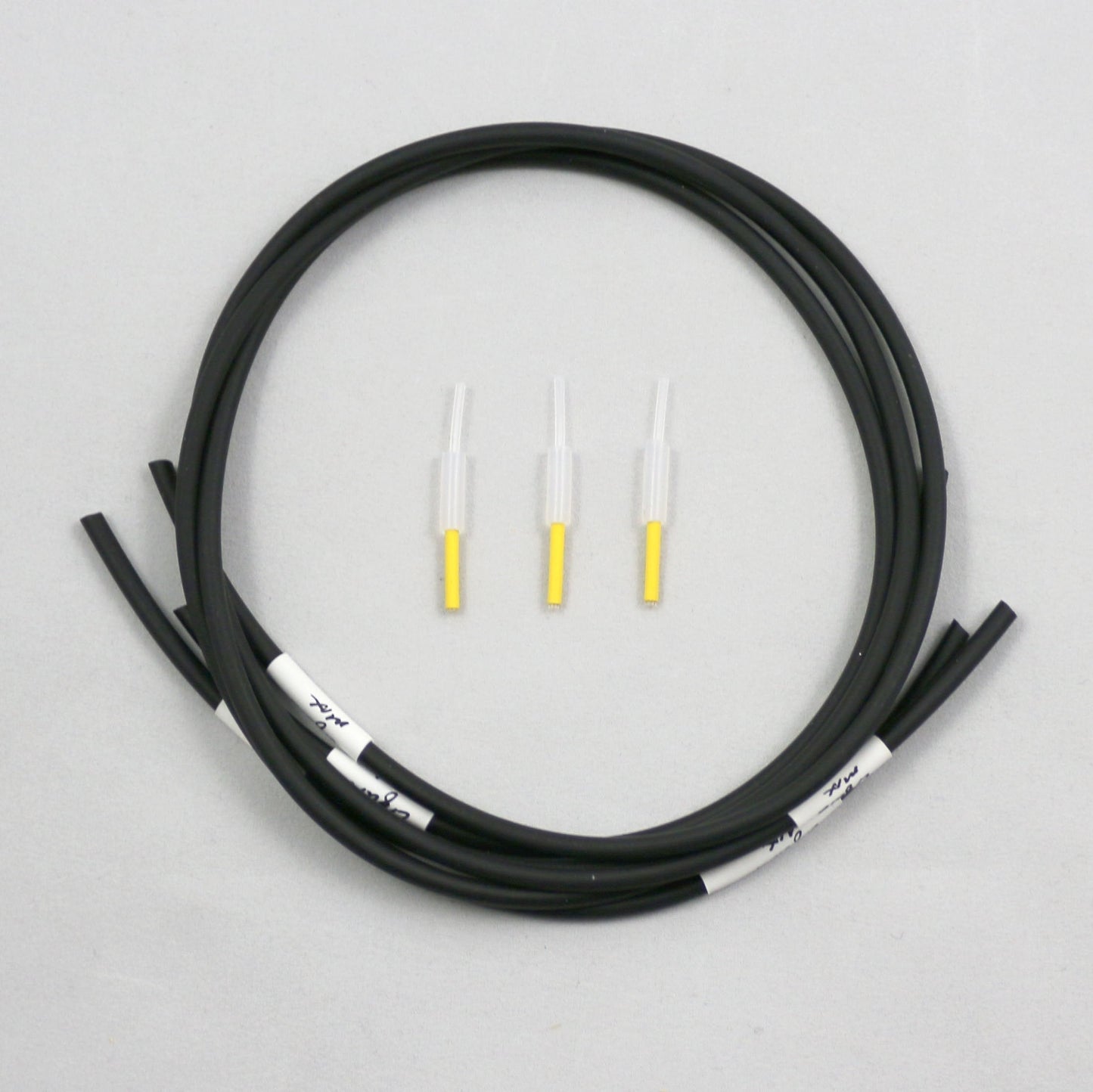 Coiled black tubing pieces with connectors