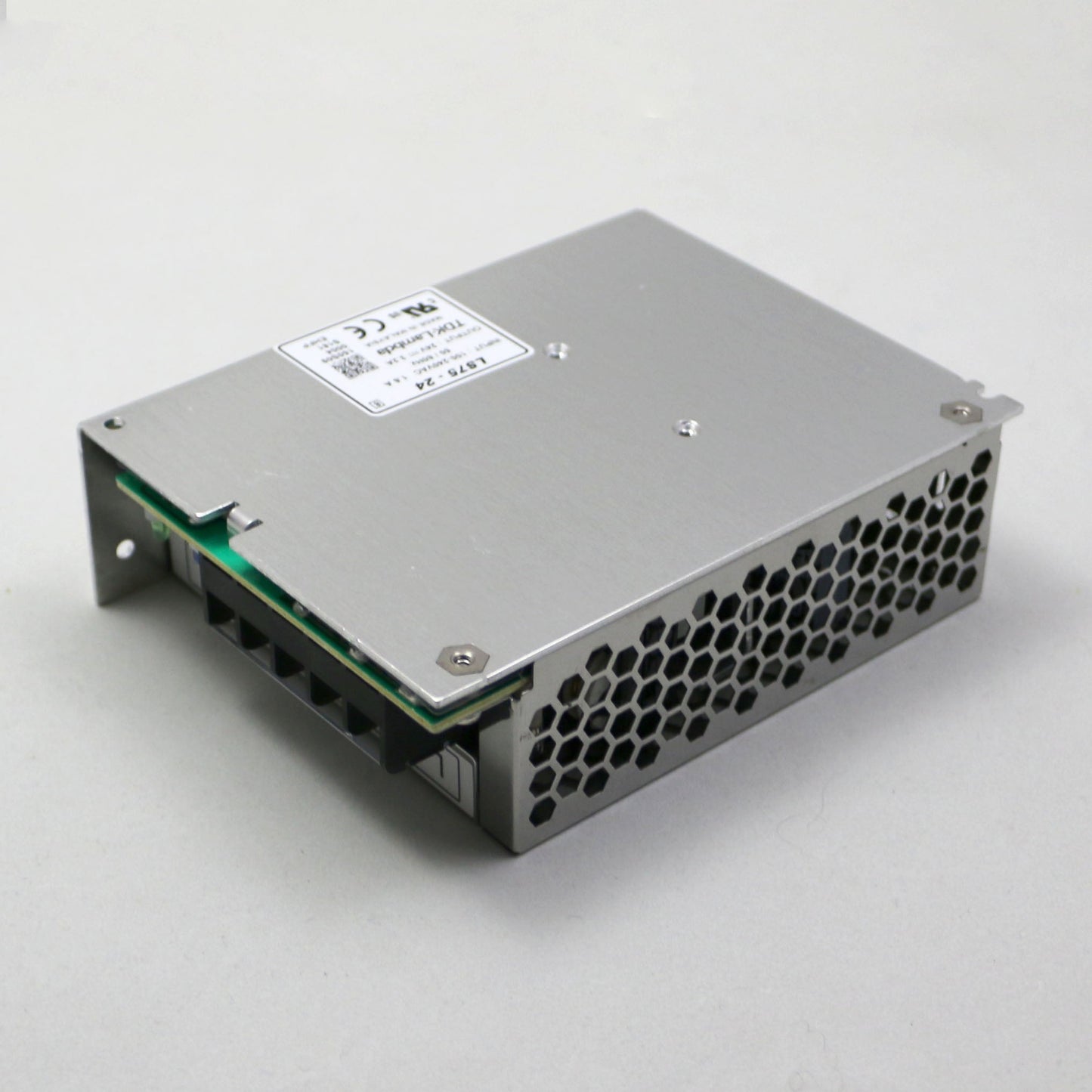 Metal electronic component with a label on a white background