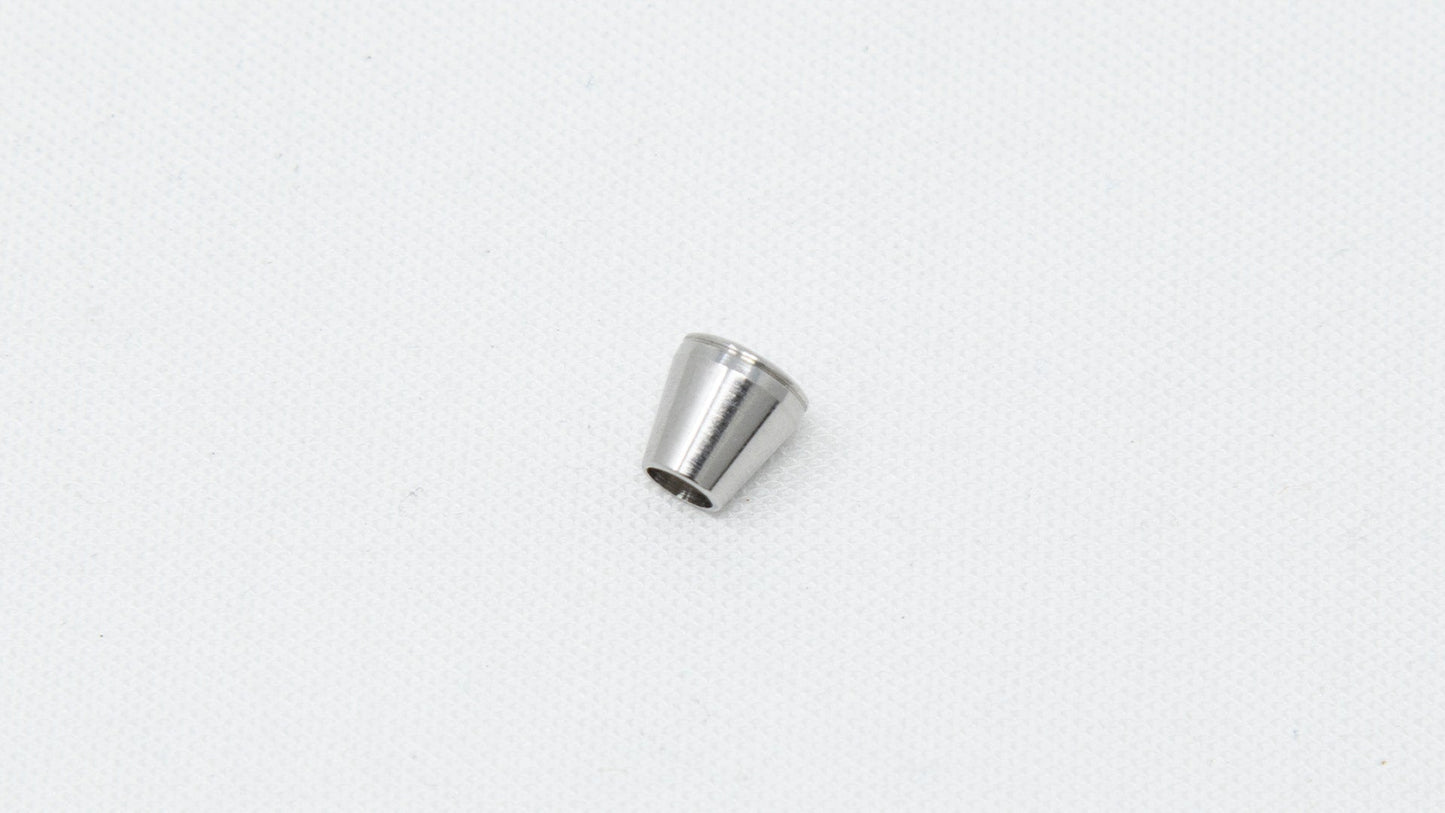 Cone shaped ferrule with hole in middle.