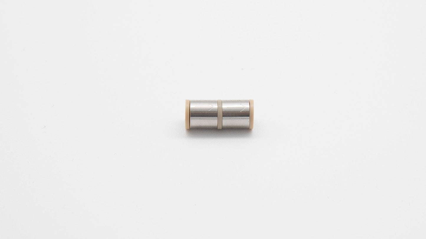 Cylinder with small hole in center.