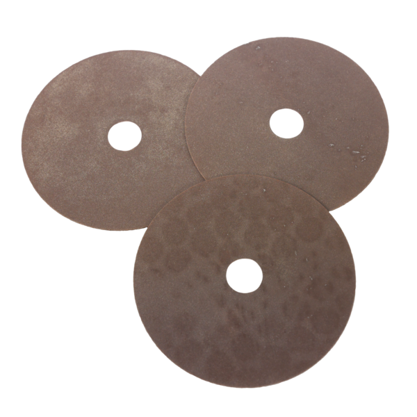Three discs with central holes on a white background