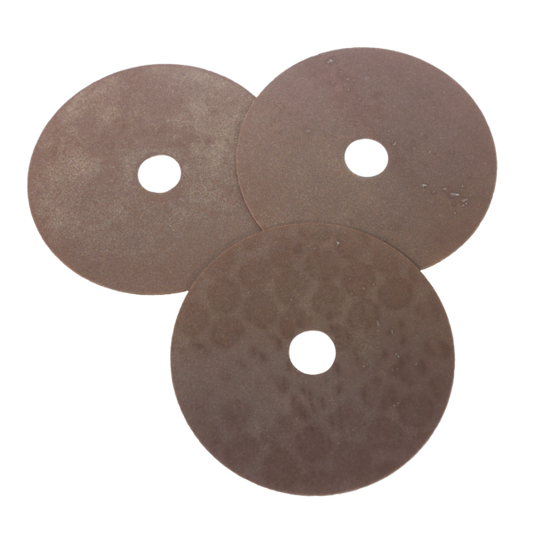 Three discs with central holes on a white background