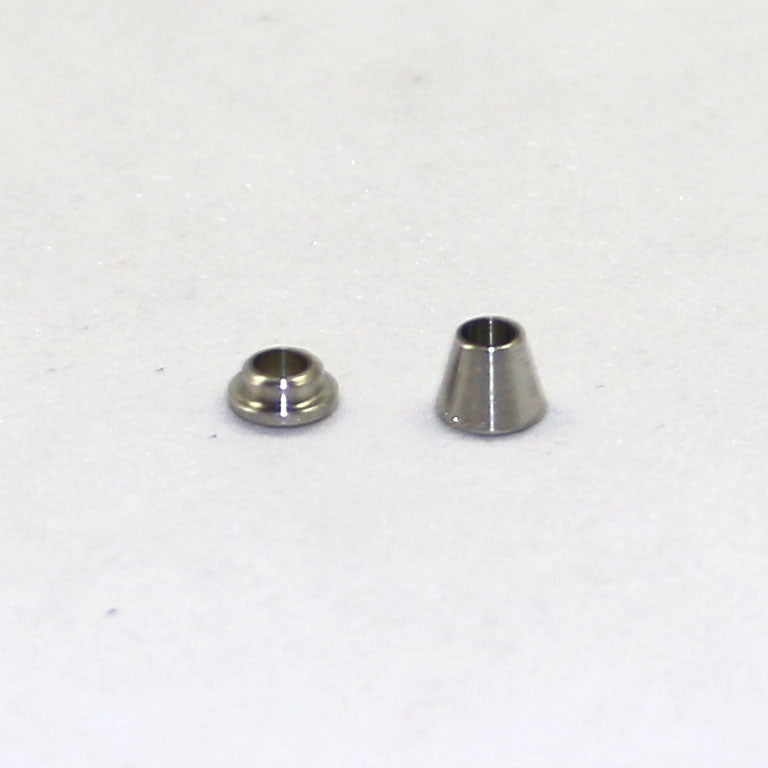 Two metallic cone-shaped objects on a white background