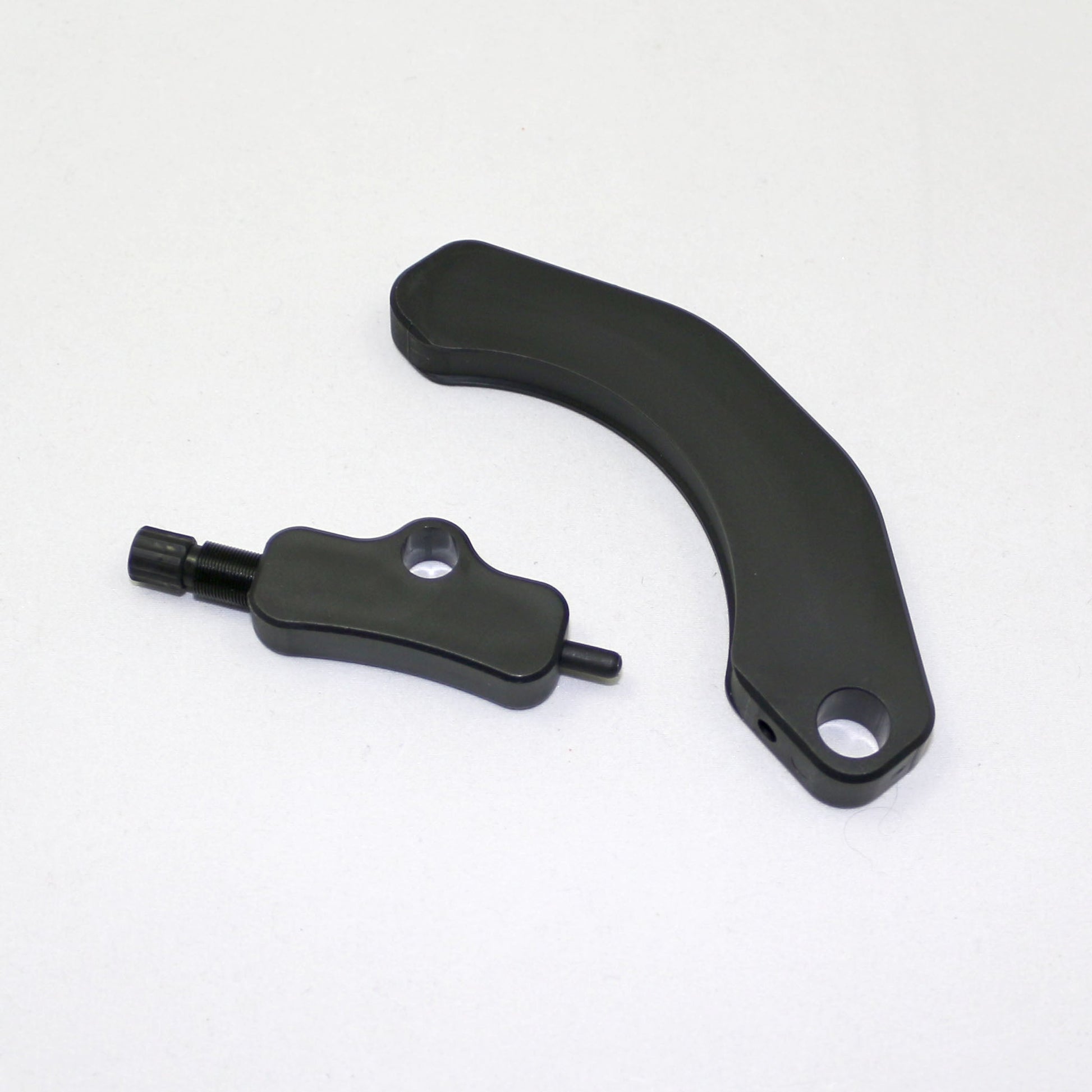 Black metal lever and arm on a white background