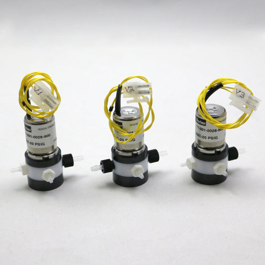 Three mechanical components with yellow wires on a white background