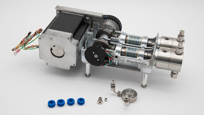 A miniature machine with pumps and several components, illustrating its compact structure and engineering precision.