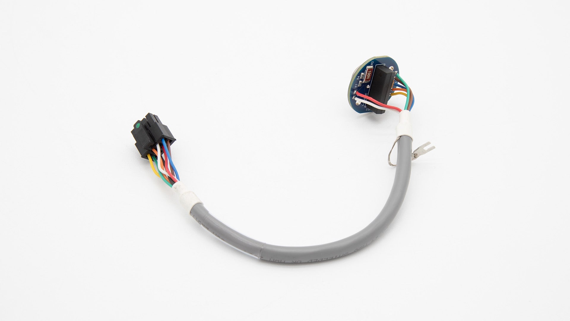 A wire with a circular object and connector