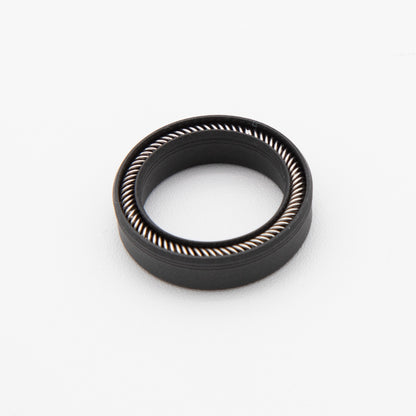 Round black seal with installed spring