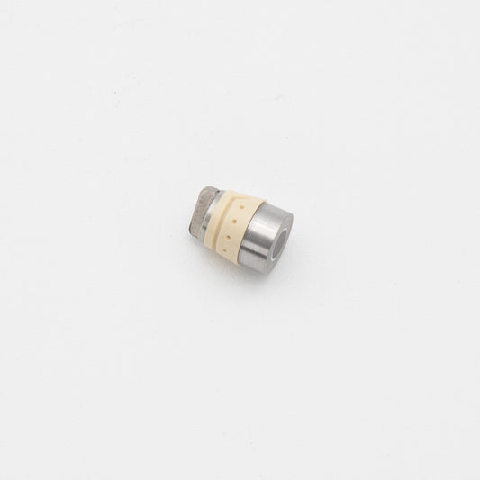 A small metal object resting on a clean white surface, showcasing its reflective surface and intricate details.