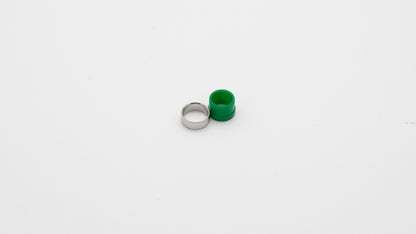 A green and silver ring