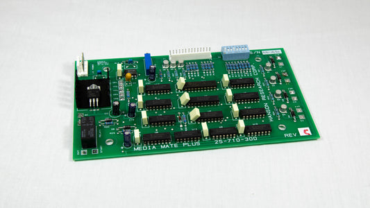 A small electronic circuit board featuring various components like resistors, capacitors, and microchips.