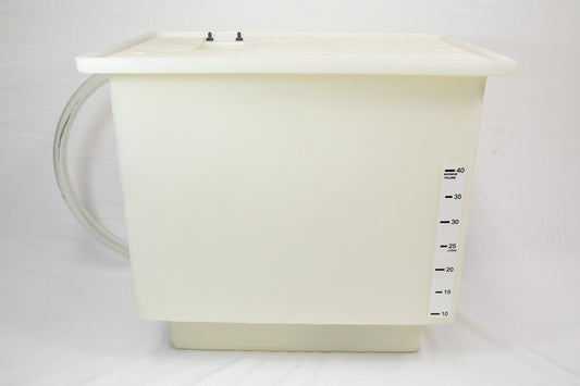 A white plastic container with a hose connected to it, likely used for storage or dispensing liquids.