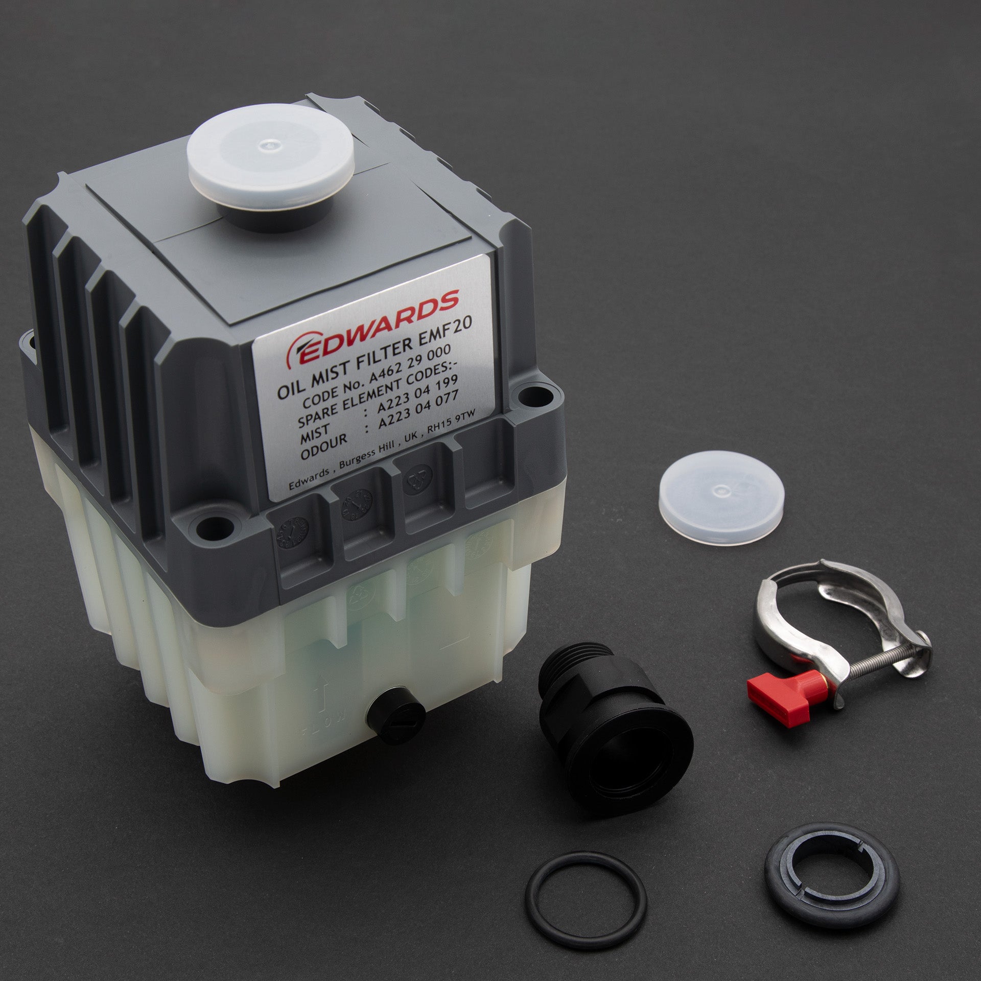 A compact oil filter with accessories, showcasing its design.