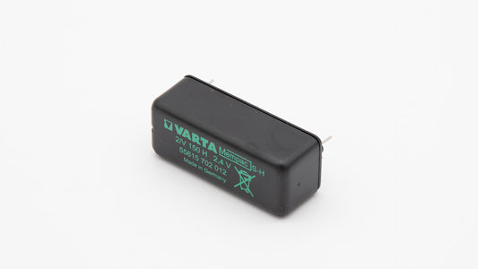 A black battery with green text