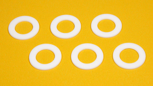 Six white round objects arranged on a bright yellow background.