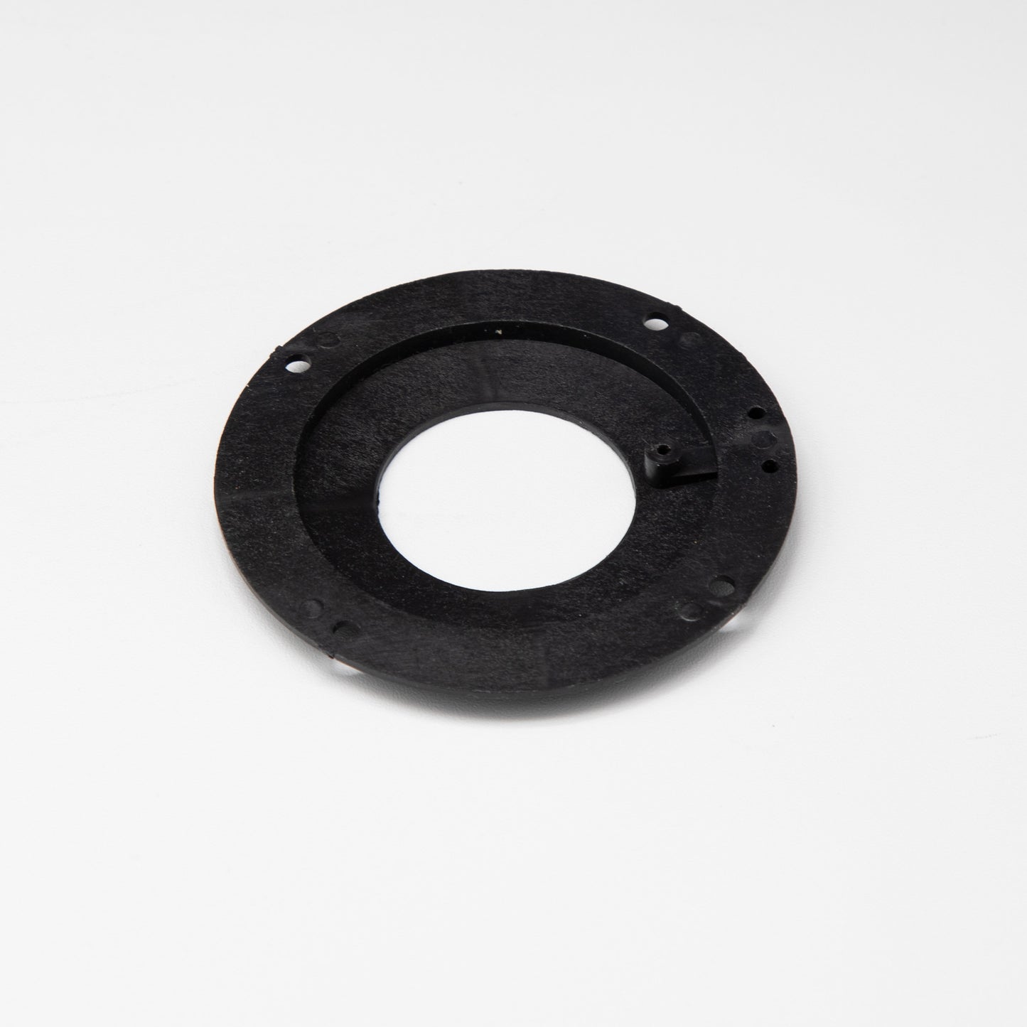 Black circular object with holes