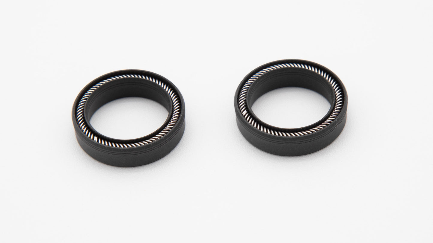 Round black seals with installed spring