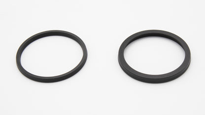 Round black seals with installed spring