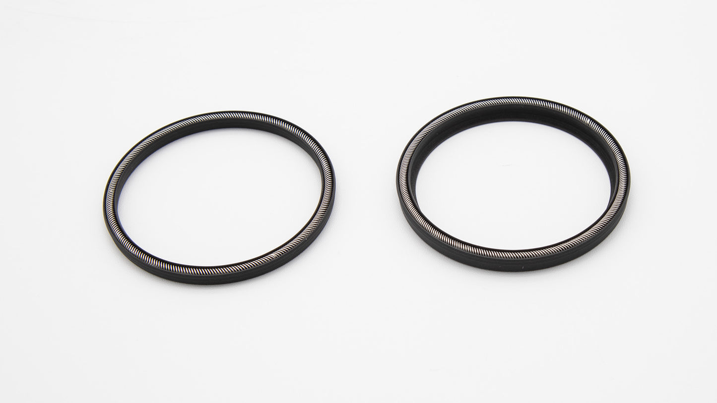 Round black seals with installed spring