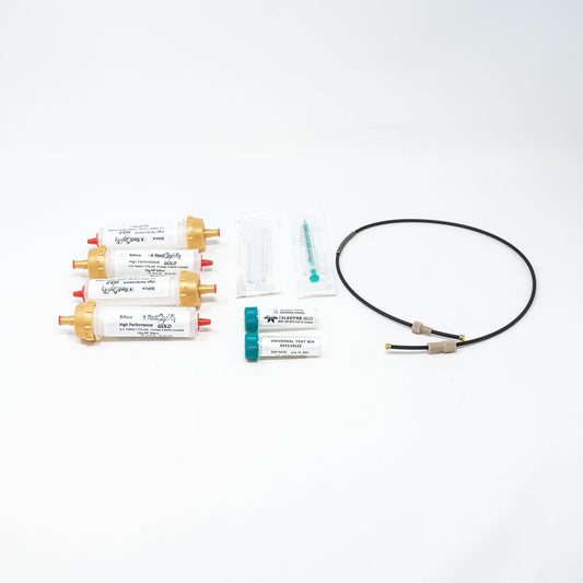 A diverse collection of laboratory items, including columns, tubing, and syringes, displayed together.