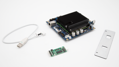 Two small electronic circuit boards with a USB cable, showcasing its compact design and connectivity features.