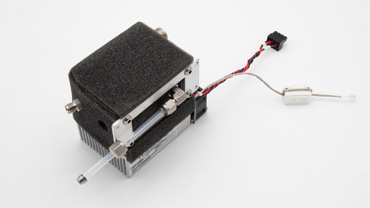 A small black device with multiple wires connected, showcasing its compact design and intricate wiring.