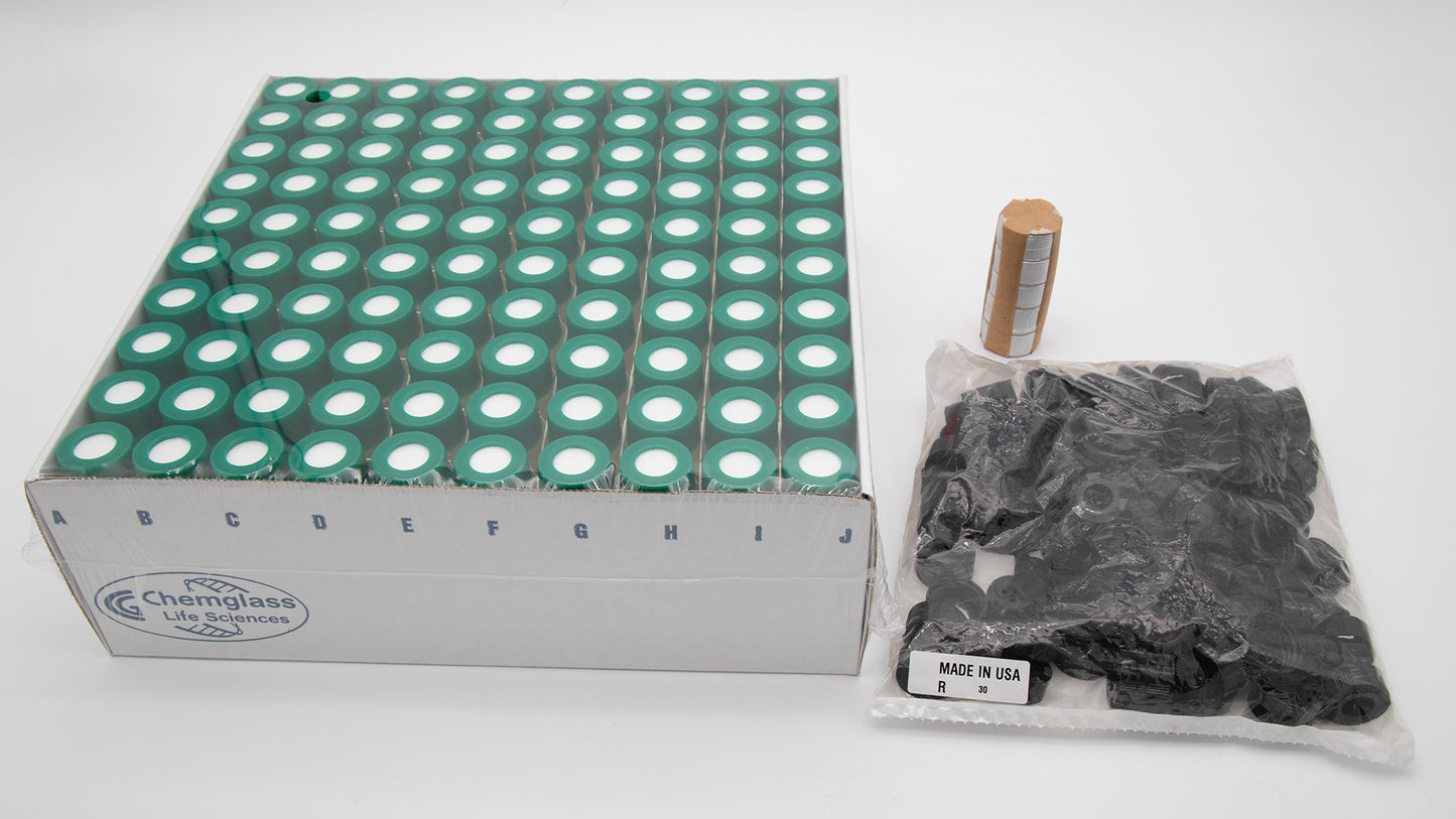 A box with vials alongside a bag with caps and a package of foil discs intended for use in a laboratory setting.