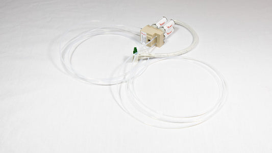 A valve with attached tubing, suggesting use in a laboratory or medical setting.