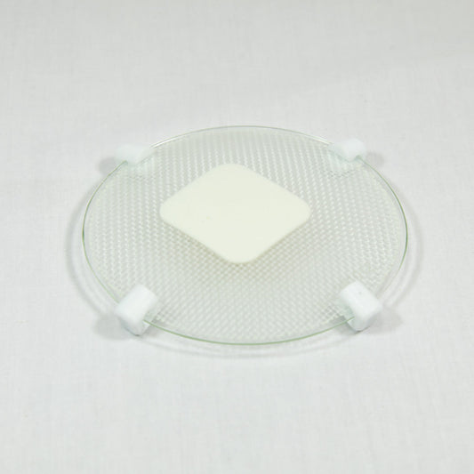 A transparent plate with a white patch, highlighting a neat and organized appearance.
