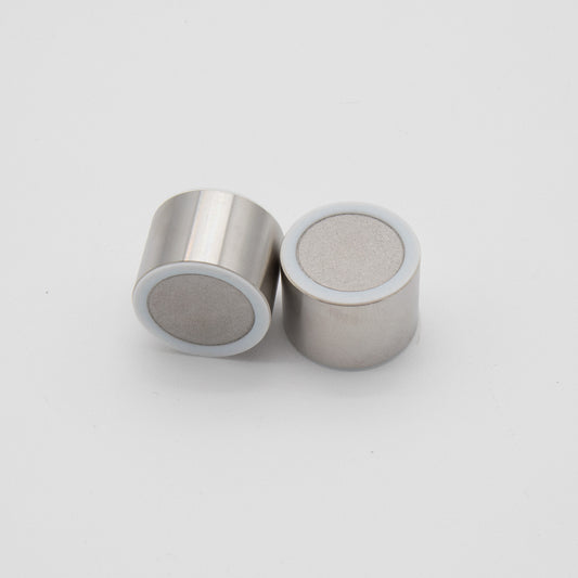 Two small cylindrical objects