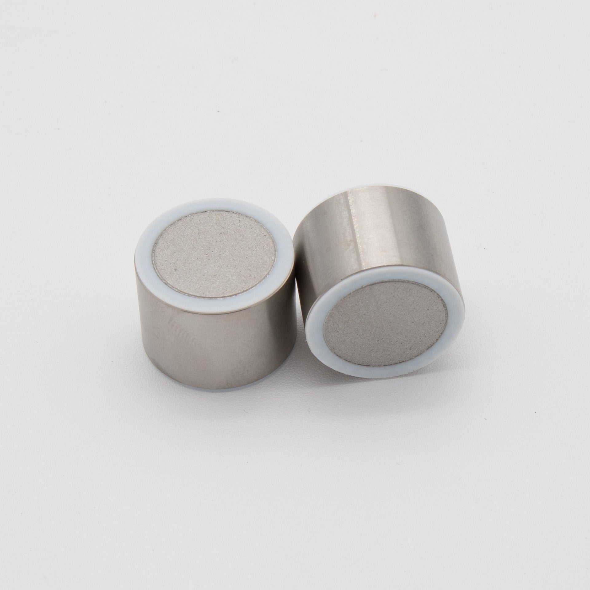 Two small cylindrical objects