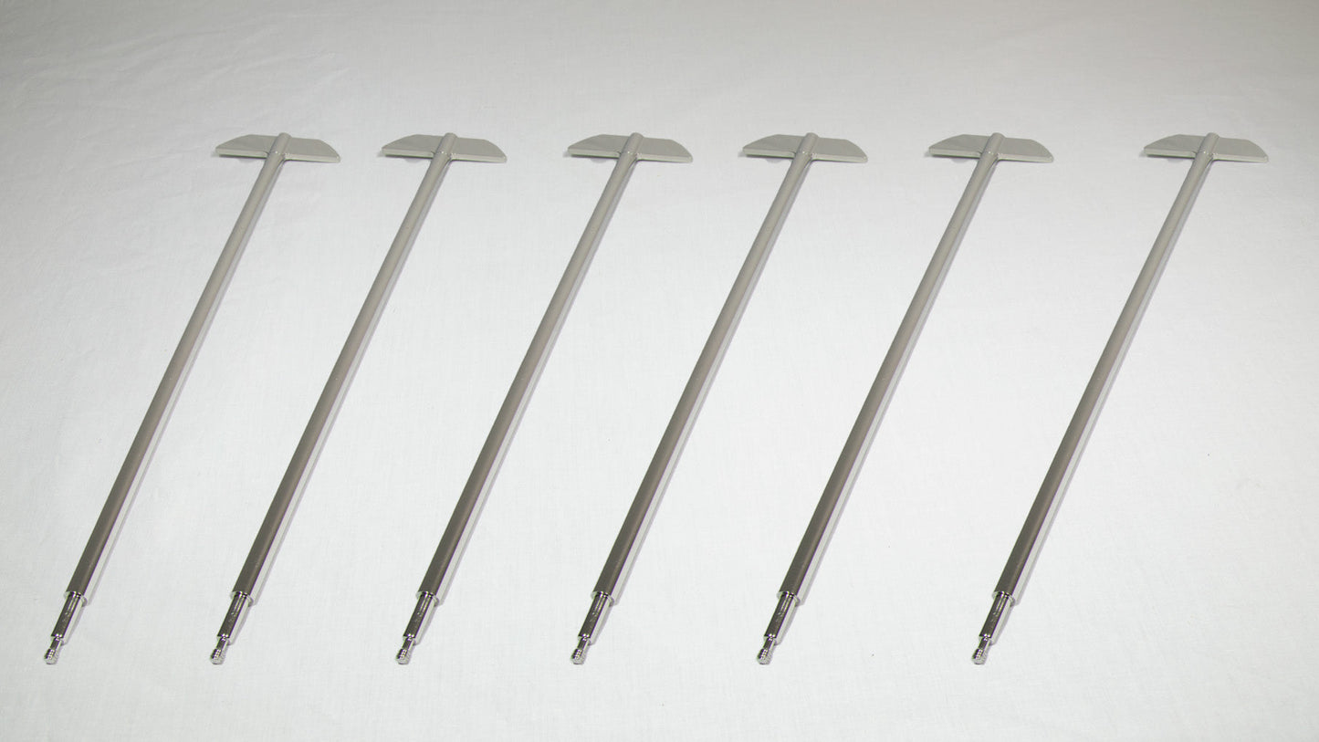 Six uniquely shaped metal rods positioned together for comparison.