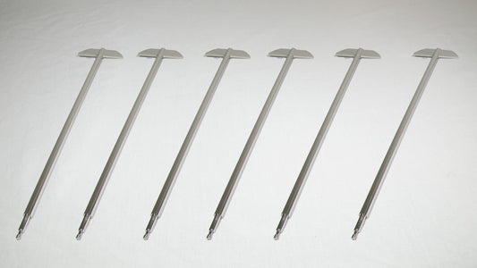 Six uniquely shaped metal rods positioned together for comparison.