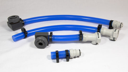 A collection of blue plastic hoses alongside various fittings arranged neatly.