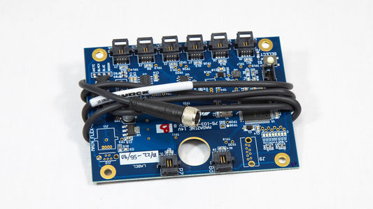A compact electronic board featuring an attached cable, highlighting its functionality and layout.