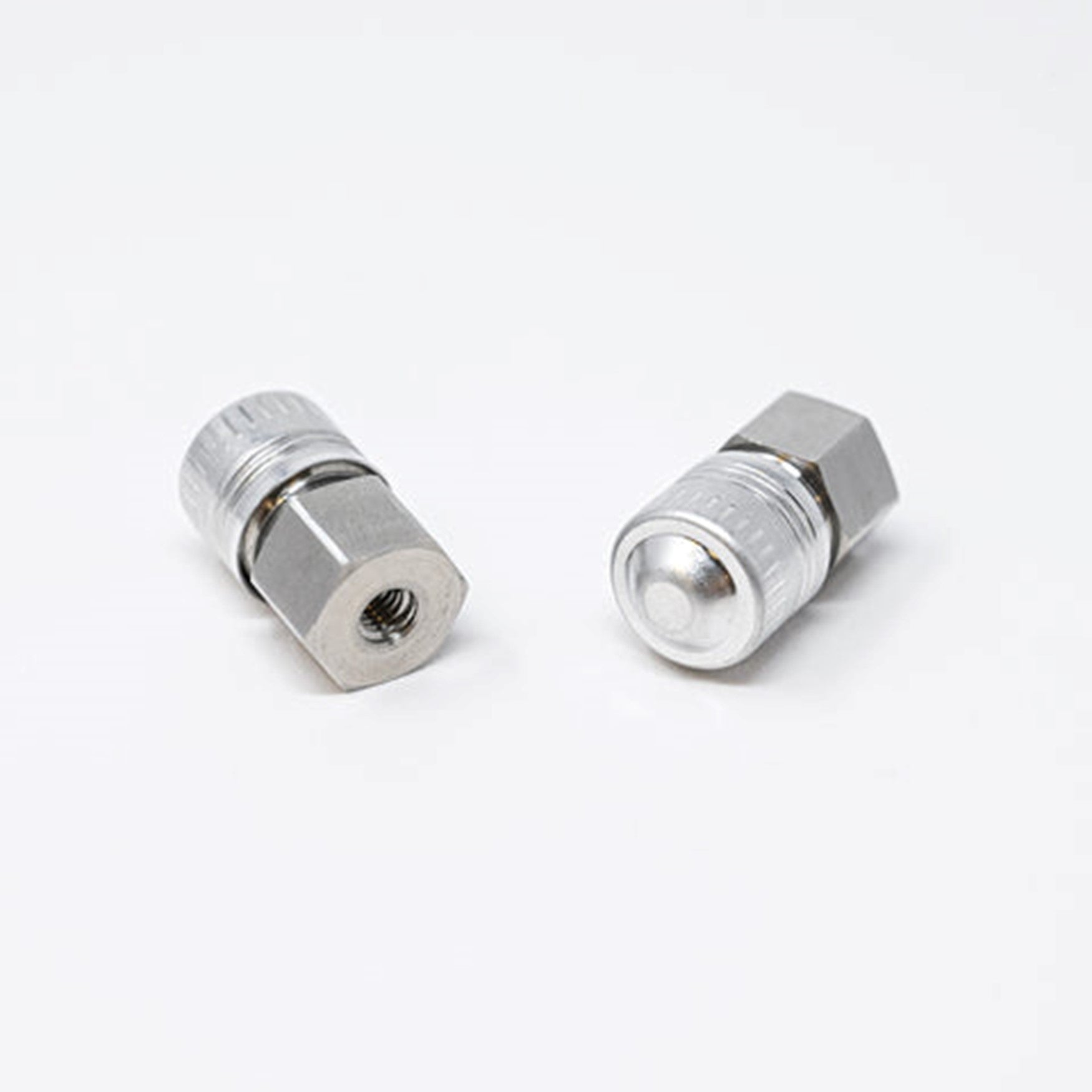 A close-up of a couple of metal nuts