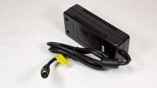 A power supply unit with a cord, designed for connecting electrical devices to an component.
