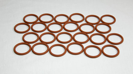 A collection of brown rubber O-rings arranged together on a neutral background.