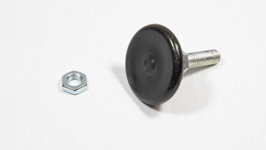 A nut and a threaded cylindrical shaped black object placed on a white surface, highlighting their contrasting colors.