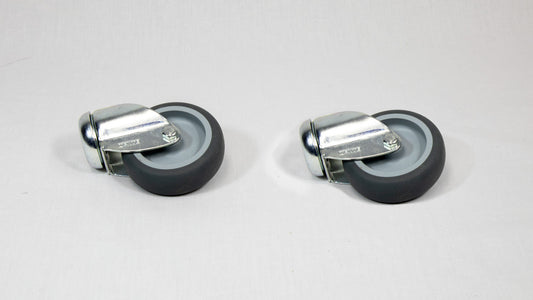 Two black wheels with silver mounts positioned on a white surface, showcasing a simple and functional design.