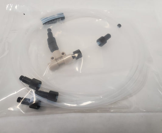 A plastic bag with a white tube and black end caps