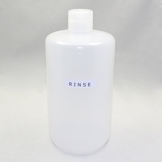 White bottle labeled 'RINSE' on a gray background