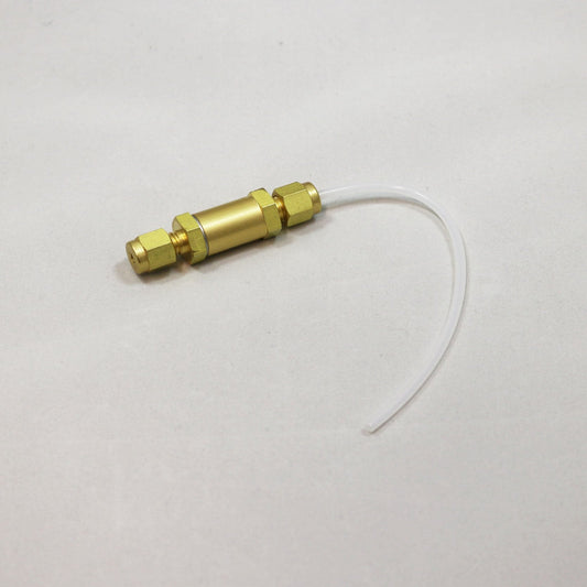 Brass connector with a piece of white tubing on a light gray background