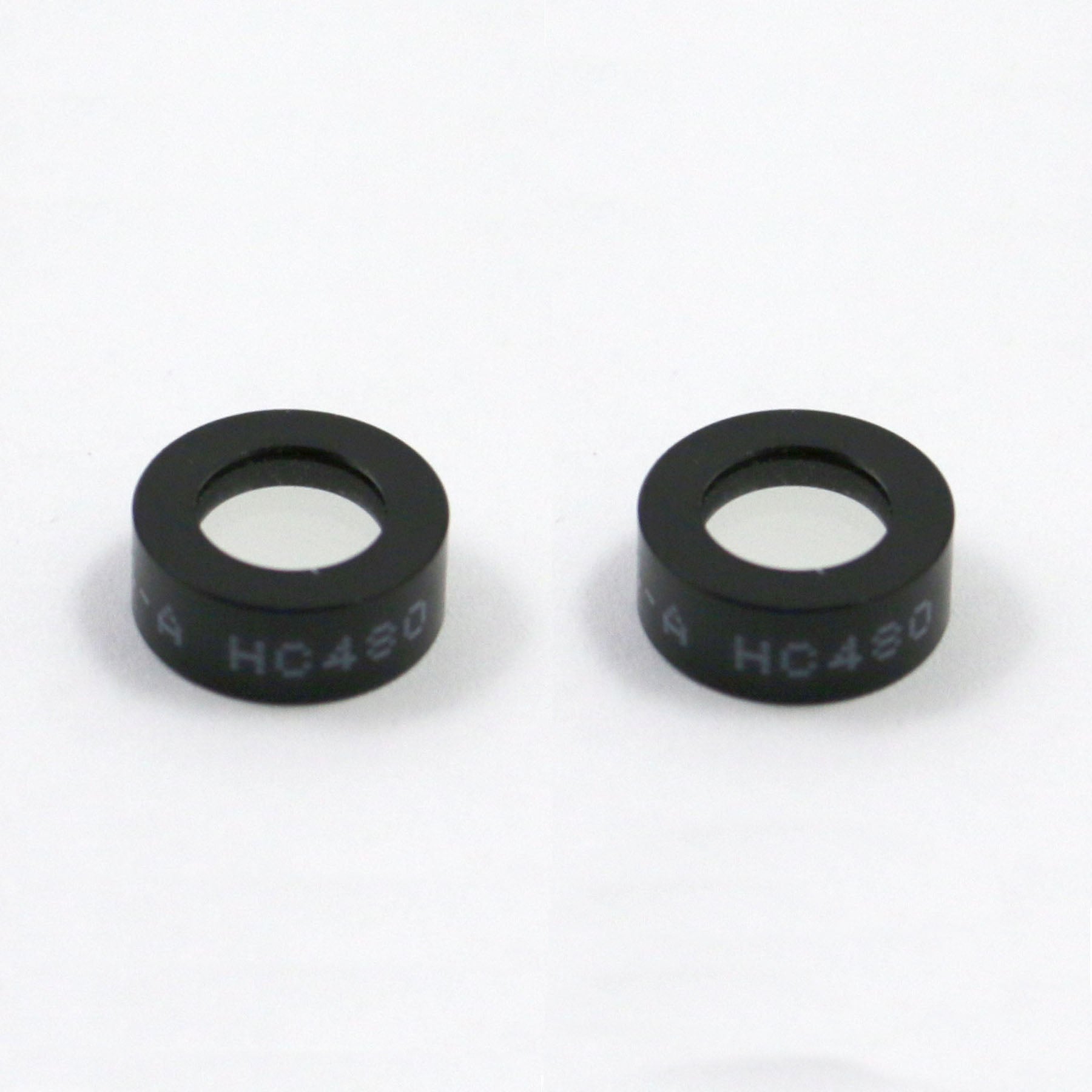 Two black circular objects with 'HC430' text on a white background