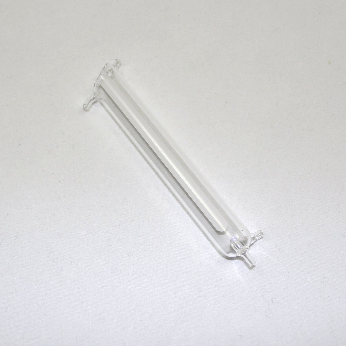 Clear glass tube on a white background