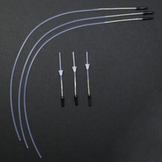 Set of medical tubing and connectors on a dark background