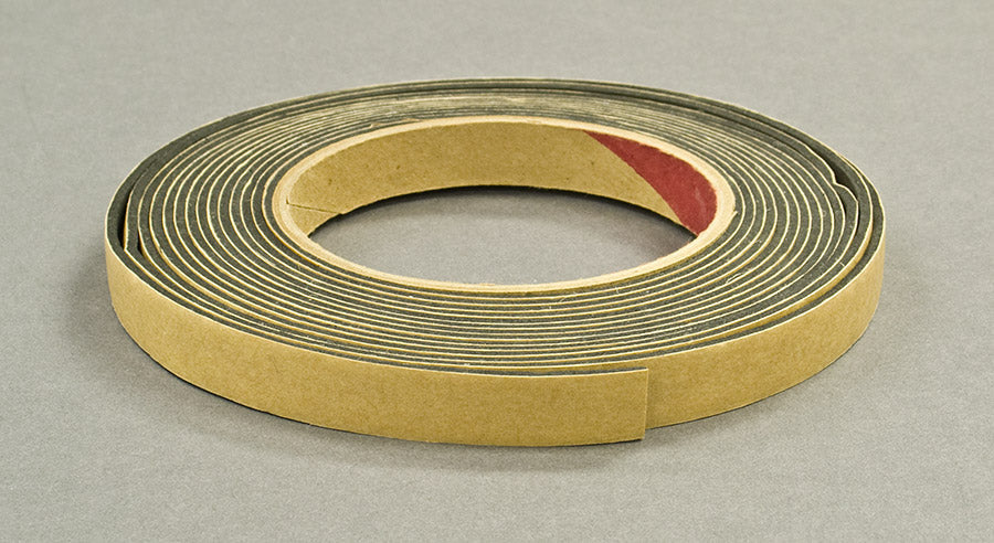 Roll of adhesive tape on a gray background