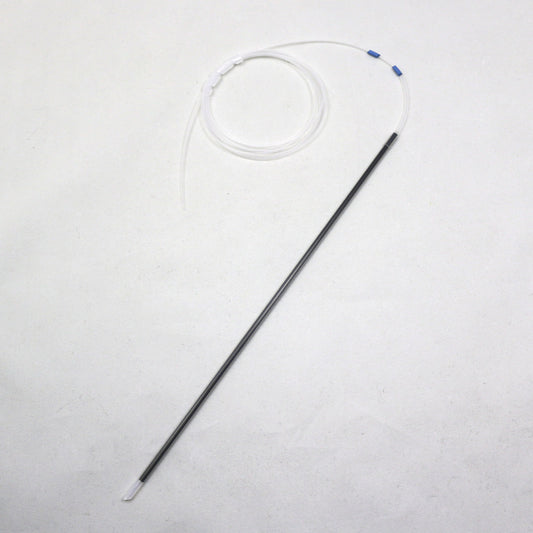 Long thin black object with a white circular component on a light gray background