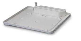 Gray metal tray with a central cylindrical component on a white background